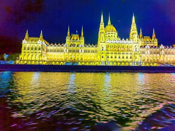 A view of Budapest at night from the river Danube.